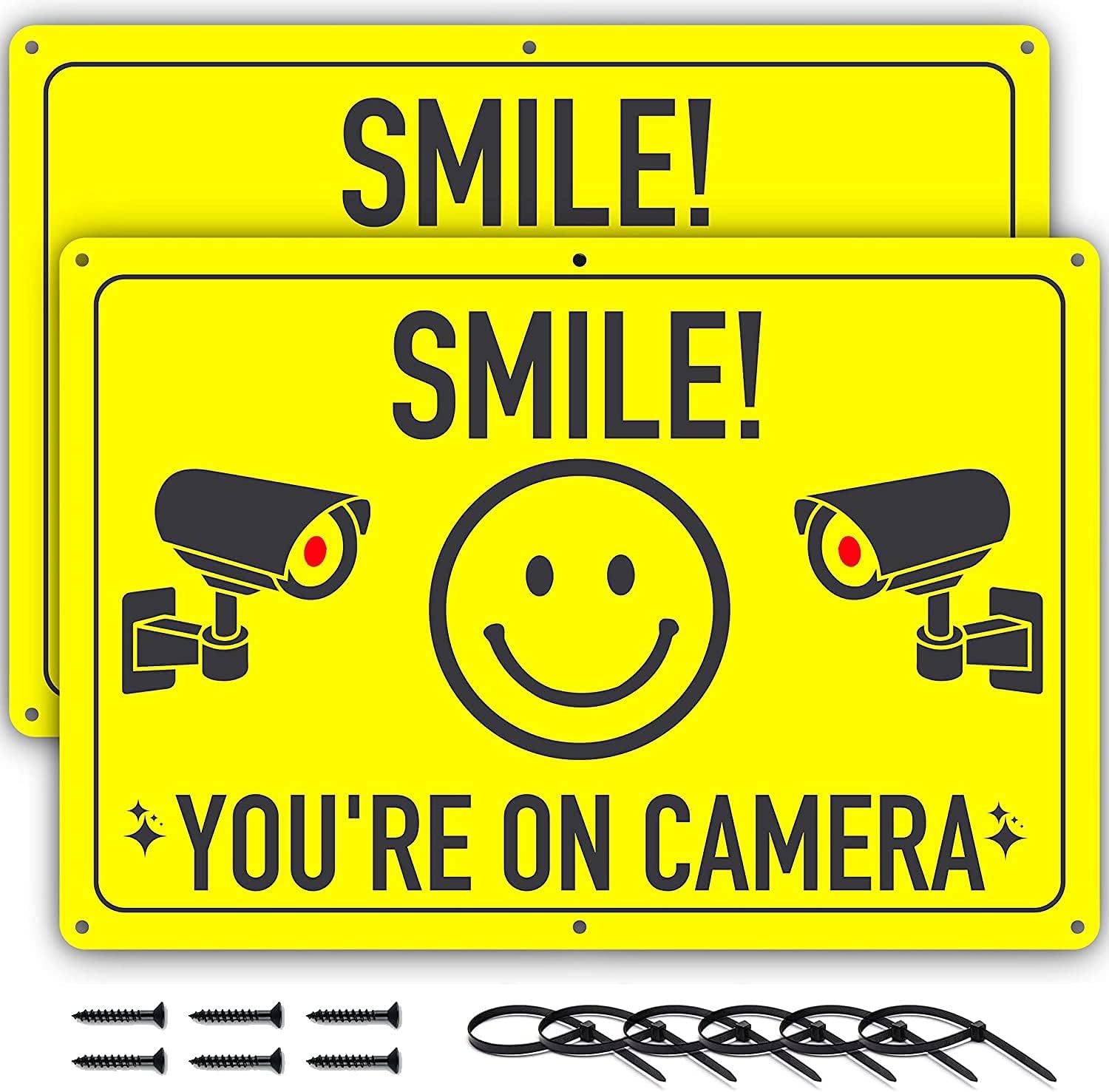 CCTV Sign, Smile You're On Camera Signs - 11.75 X 8 Inch Aluminium - 2 Pack - Ideal for Video Surveillance and Prevent Trespassing on Private Property - Perfect for House, Business, Yard, or Driveway